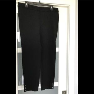 Stretch pull on pants with button detail.